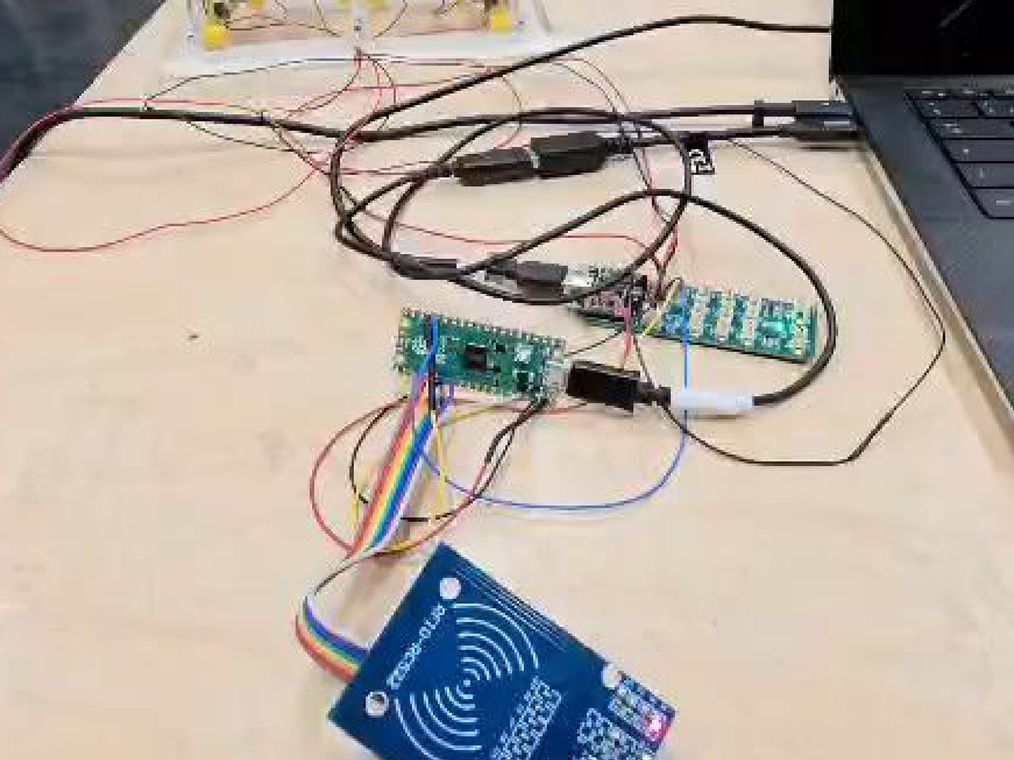 The electronics on the bench: an RFID reader and a Raspberry Pi Pico before integration.
