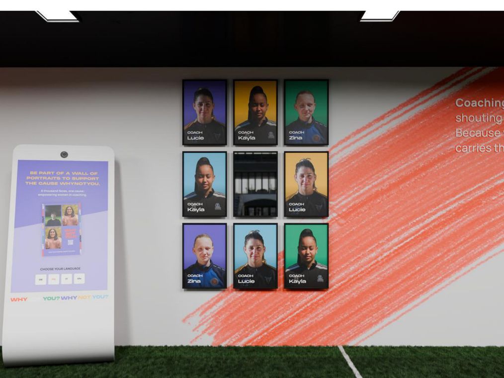 A render of the mosaic wall: a grid of coach portraits beside a kiosk inviting visitors to add their own, on a brushstroke backdrop.
