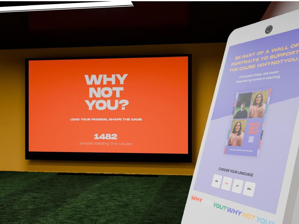 A render inside the booth: a tablet inviting visitors to join a wall of portraits, beside a screen reading Why not you? and 1482 people leading the cause.